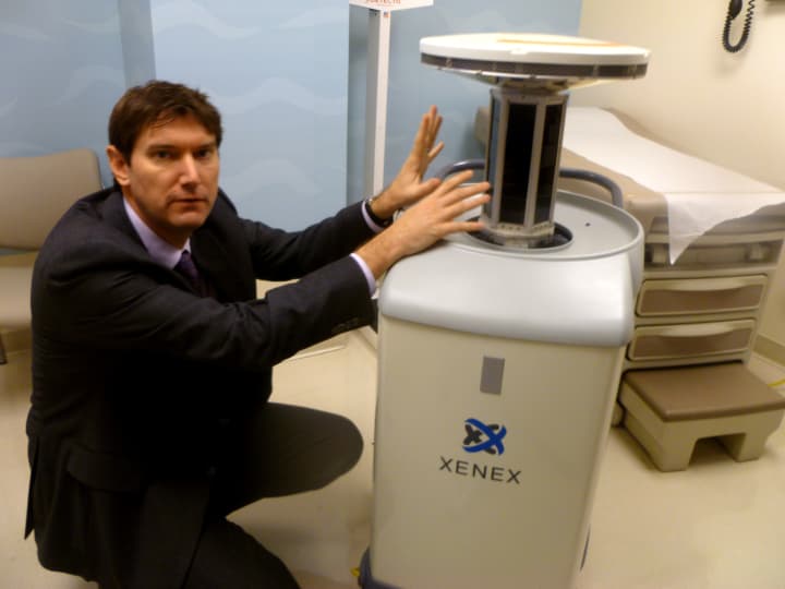 Dr. Mark Stibih, founder and chief scientific officer for Xenex Healthcare Services, shows how the room-disinfection device will be used in Stamford Hospital. 