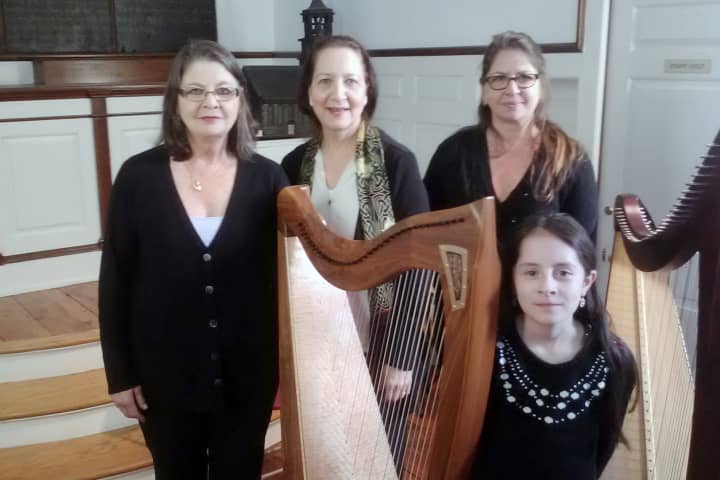 From left, Lois Colin, Maggie Skau, Karen Colin and Maggie Varenne of the Westchester Harp Ensemble perform at St. Paul&#x27;s Historic Church in Mount Vernon on Wednesday.