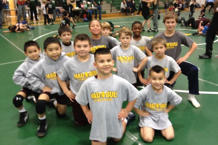 Wrestlers in the Madull program in Norwalk get ready for their first meet of the season last weekend in New Milford.