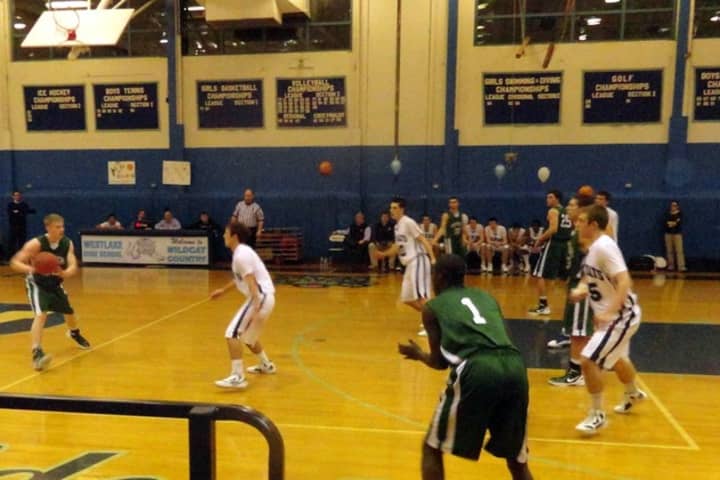 The Pleasantville High School boys&#x27; basketball team (in green) will play in the Bill Green Basketball Tournament this weekend.