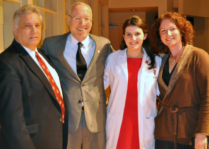 From left: Dr. Bud C. Tenant, DVM, a professor of comparative medicine at Cornell, Dean Michael Kotlikoff, Leah Simons, and Dr. Elizabeth Berliner, DVM, who coated Simons.