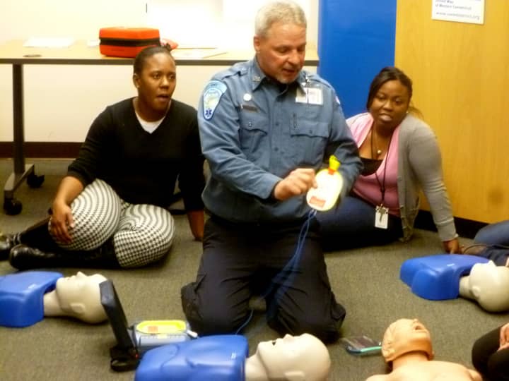 Paul Moeller of Stamford Emergency Medical Services demonstrates how to use a defibrillator. 