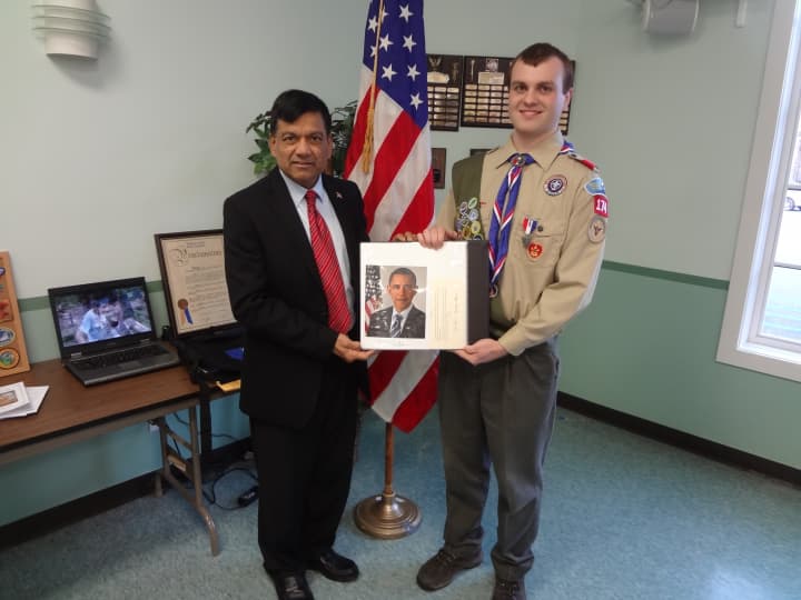 Yorktown council member Vishnu Patel presented a certificate to Eagle Scout Robert Athanasidy.
