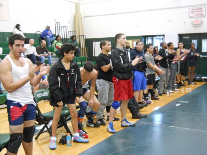 The Yonkers Public Schools wrestling team applauds a teammate following a win. The team is flourishing in its sixth season under the guidance of coach Pete Vuplone.
