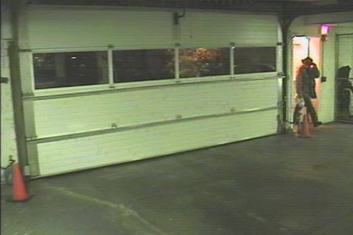 An intruder can be seen in a still image from a security camera at a parking garage entrance at The Osborn at 1 a.m. Aug. 27. The intruder appears to be tipping his hat to obscure his face, Osborn CEO Mark Zwerger said.