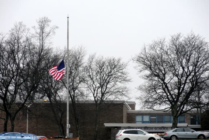The flag outside of Westlake High School is hung at half-staff Monday following Friday&#x27;s tragedy in Newtown, Conn. 