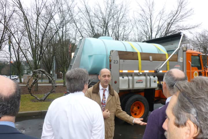 Greenburgh Department of Public Works Commissioner Victor Carosi shows the Town Board the new brine truck that will help in snow removal this winter.