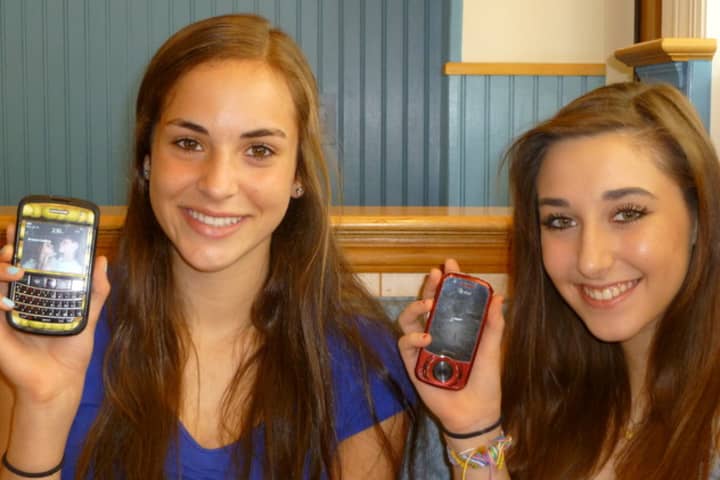 Fox Lane juniors Briannae Hallock, left, and Sara White can&#x27;t wait for cell service to come to Scotts Corner.