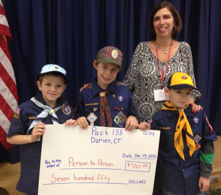 Luke Riordan, Jacob Grimm and Brenton Ingulli, the top popcorn sellers of Darien&#x27;s Cub Scout Pack 155 with Pat Cage of Person-to-Person.