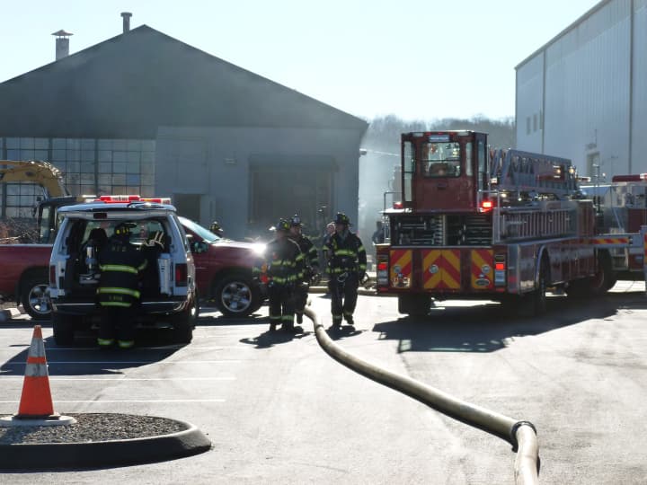 Norwalk firefighters extinguish a dust collector fire Wednesday at D&#x27;Orio Custom Wood Works on Wilson Avenue.