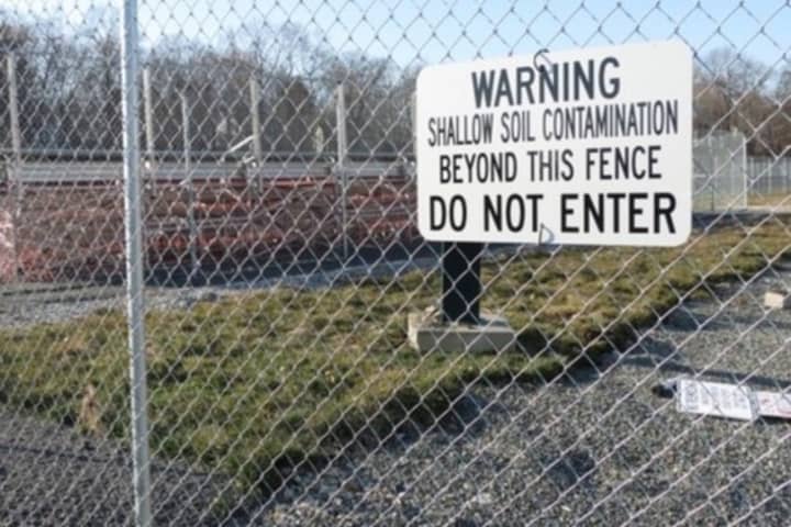 An old sign at the athletic fields at Greenwich High after reports surfaced of hazardous chemicals in the soil.