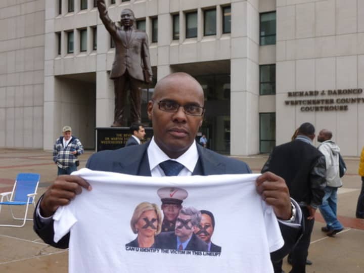 Kenneth Chamberlain Jr. protests a Westchester grand jury&#x27;s May 2 decision not to indict the White Plains police officers involved in the shooting of his father.