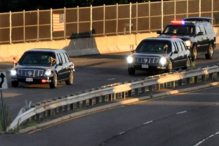 The presidential motorcade travels down Sherwood Island Connector in Westport on Aug, 6.