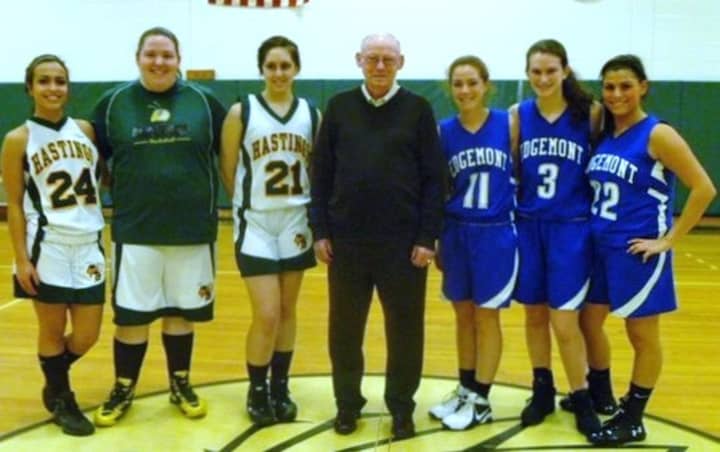 John Costello, center, last year hosted the holiday tournament named in his honor. 
