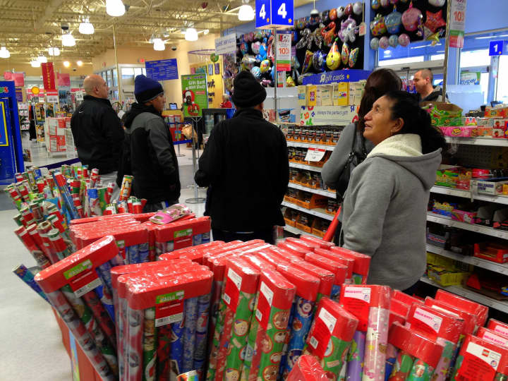Last-minute shoppers stand in line at the Toys &#x27;R&#x27; Us store in Jefferson Valley. 