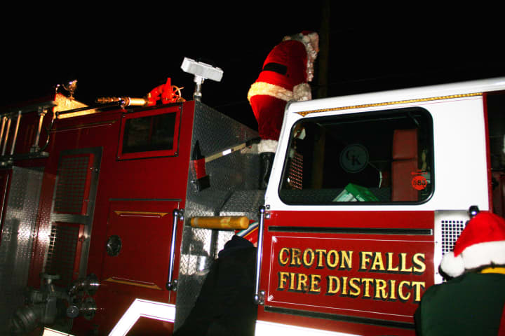 Santa arrived at the North Salem tree lighting on a Croton Falls firetruck.