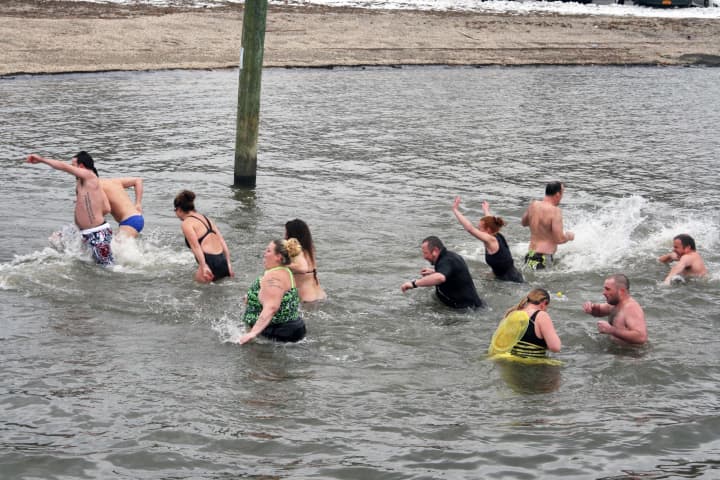 Fourteen people plunged into the Hudson River in Peekskill on New Year&#x27;s Day to support the This Is Me Foundation.