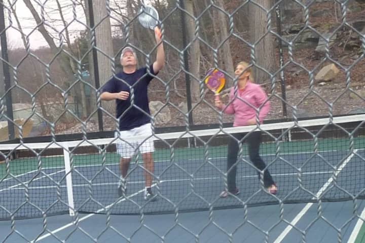 Dave and Sheila Mueller of Darien compete in the Connecticut State Mixed paddle tennis tournament last year.