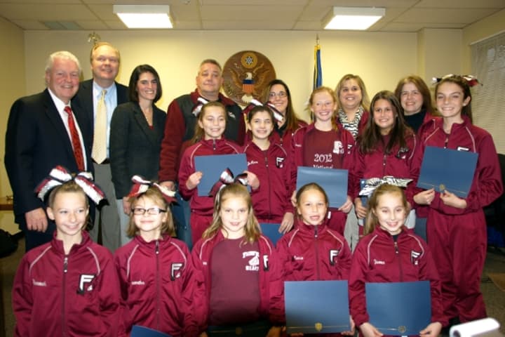 The Fairfield Giants Cheerleaders and their coaches pose with Fairfield&#x27;s Board of Selectmen at a ceremony in their honor Wednesday.