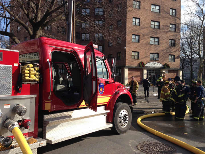 Firefighters outside the Winbrook housing complex in White Plains