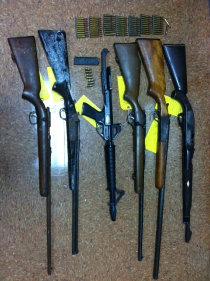 The guns shown here were confiscated when Stamford police raided a home.  