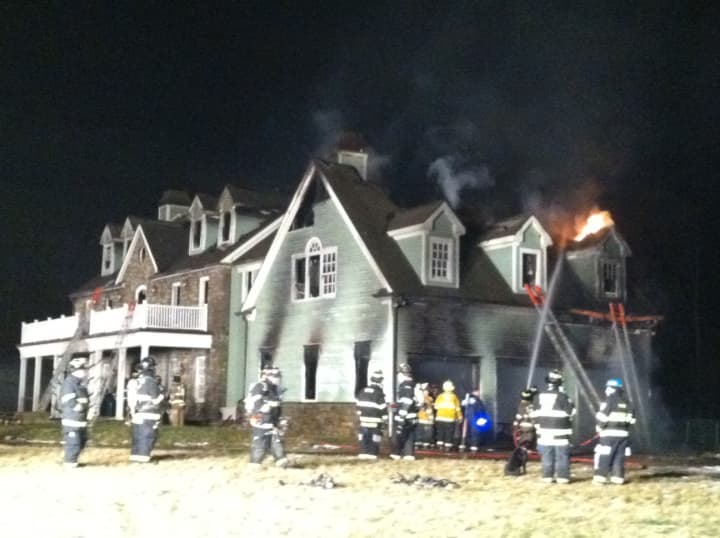 A Bedford Hills home is engulfed in flames Tuesday night.