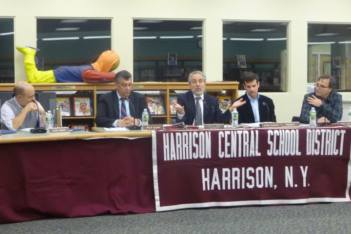 The Harrison Board of Education and Superintendent Lou Wool discuss school safety Wednesday night at the first meeting since the deadly Newtown school shooting.
