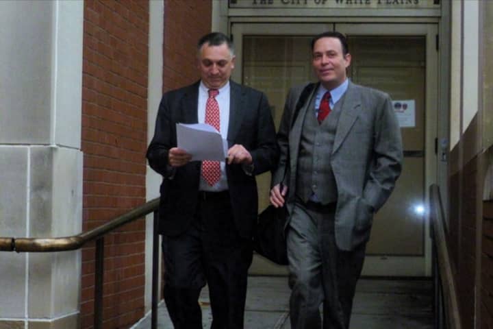Former White Plains Mayor Adam Bradley (left) walks out of City Court with his lawyer, Randall Cutler.