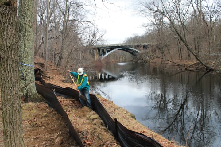 A double-layer erosion and sediment control barrier was installed Monday along the Saugatuck River at the Westport Weston Family Y&#x27;s Mahackeno Center in preparation of construction on the new Y facility.