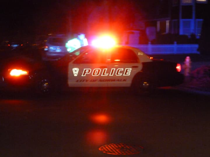 Norwalk police cruisers block Blackstone Drive on Tuesday night where Officer Kenneth Cerulli fatally shot himself.