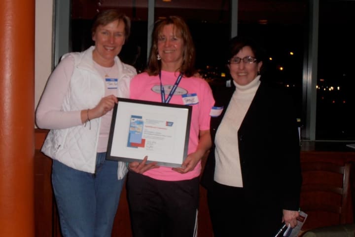 SpinOdyssey 2012 co-chairs Terri Polley and Patty Kondub accept the Labaree Award from Peg Camp of the American Cancer Society.
 