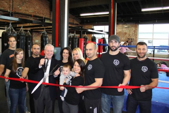 First Selectman Michael Tetreau cuts the ribbon on Fit Club along with the Fairfield gym&#x27;s owners and staff earlier this month.