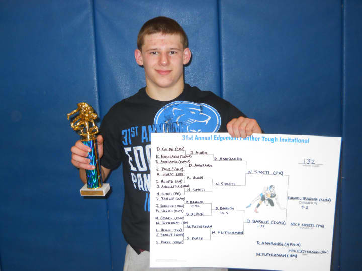 Scarsdale&#x27;s Daniel Baruch displays his first-place trophy and bracket chart after winning the 132-pound championship at the Edgemont Wrestling Tournament Saturday.
