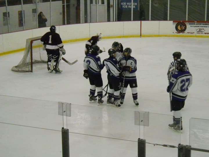 New Rochelle congratulates Chris Ramondelli, #10, on the first of his three goals in a 7-4 win over Fordham Prep Monday.