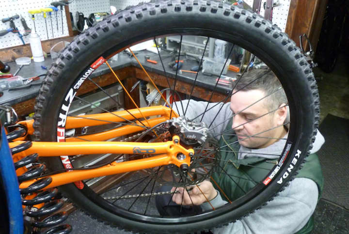 Francisco Sierra, owner of Sierra Cycles, works on a bicycle at his shop that just relocated from Scarsdale to Hartsdale.