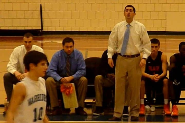 Stamford boys basketball coach Dan Melzer directs his team during Tuesday&#x27;s game against Wilton.