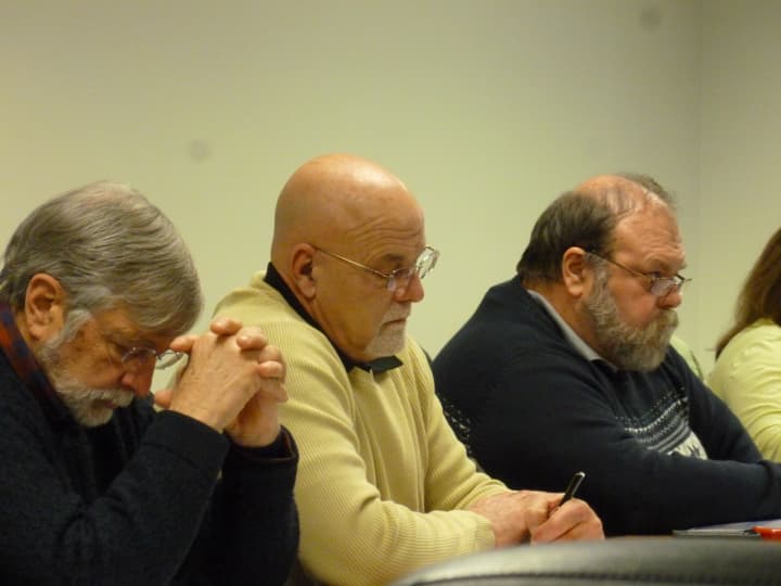 From the left, Common Council members John Igneri, Jerry Petrini and Doug Hempstead Monday listen to the proposed school spending plan for next year. 