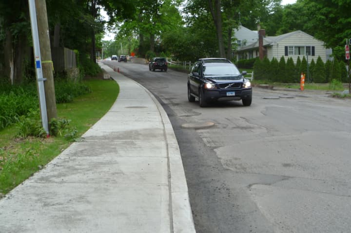 New Canaan residents are hoping that some streets in town have new sidewalks or fixes to damaged ones. This sidewalk was installed on Main Street last year. 