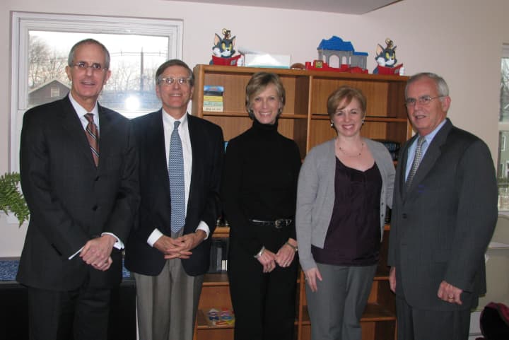 Representatives of Berchem, Moses &amp; Devlin meet with Homes With Hope CEO and President Jeff Wieser, second left. See story for photo identification.