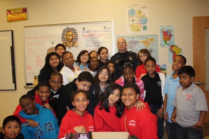Peekskill Police Officer Leo Dylewski with Peekskill sixth graders. Dylewski leads the district&#x27;s D.A.R.E. and G.R.E.A.T. programs.