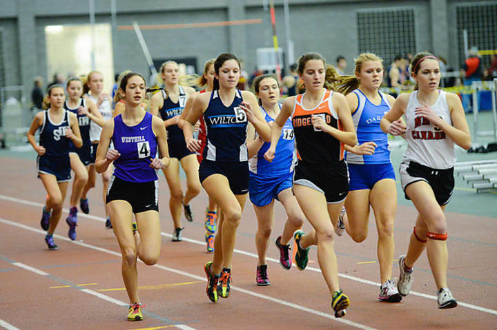 Westhill&#x27;s Claire Howlett, left, runs in a tightly-bunched field during Thursday&#x27;s league championship meet in New Haven.