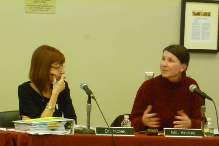 New Canaan Schools Superintendent Mary Kolek, left, and Board of Education Chairwoman Alison Bedula discuss possible changes to school calendars at Monday&#x27;s school board meeting.