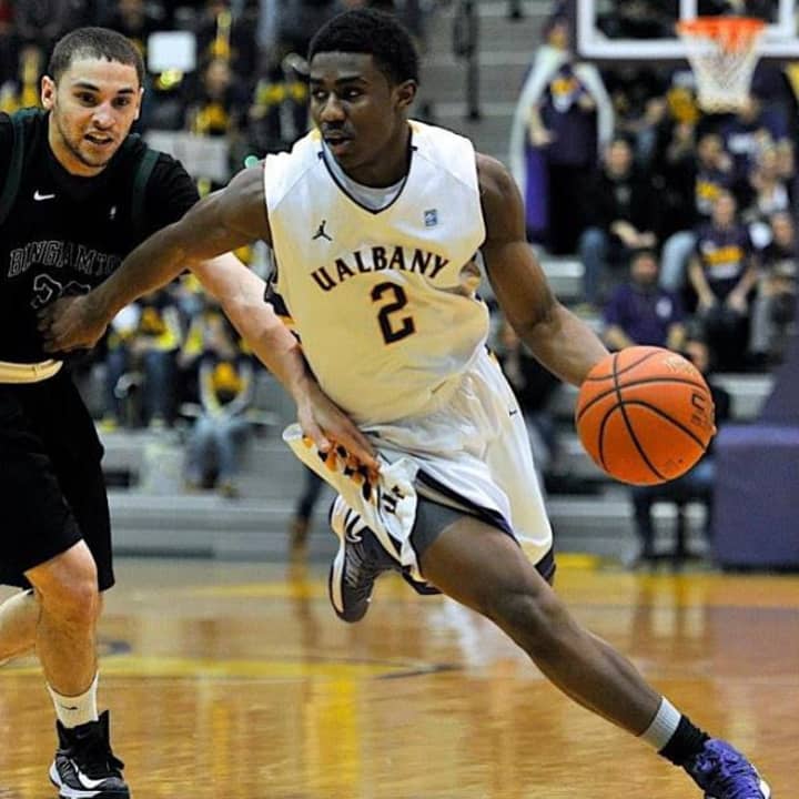 White Plains resident Reece Williams, right, playing for the University of Albany.