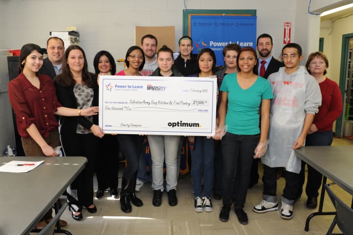 Members of Peekskill High School&#x27;s Interact Club accepted a $1,000 check on behalf of the Peekskill Salvation Army. The donation comes from MSG Varsity and Cablevision.