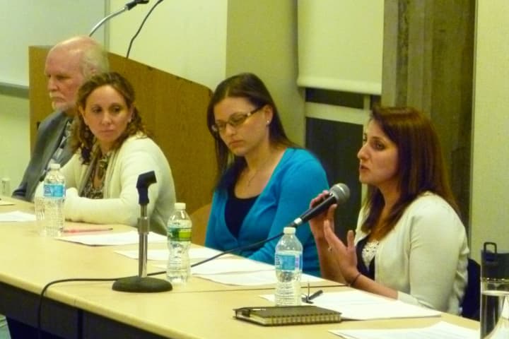A panel of guidance counselors from the Greenwich school district answers questions from a crowd of parents at a youth mental health panel discussion on Wednesday.