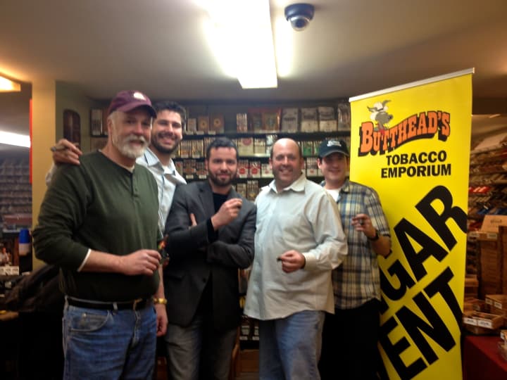 Bill Schweitzer, customer; Terence Reilly,national sales manager for Quesada cigars, Brett Bowersox, independent manufacturer representative; Kevin Paige, owner; and Peter Glad, social media manager, gather for a cigar event.