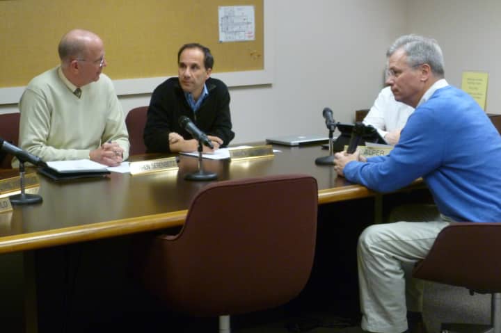 Jeffrey Rutishauser, right, talks with members of the Wilton Board of Finance on Tuesday before being elected to the board. Rutishauser previously served on the finance board from 2000 to 2004. 