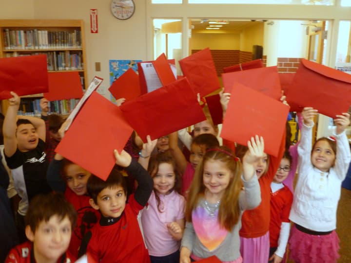 Pound Ridge Elementary students show their enthusiasm for the Valentine&#x27;s Day Book Exchange.