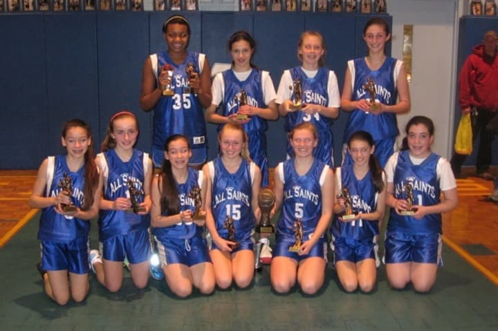 The varsity girls basketball team at All Saints Catholic School in Norwalk won the Tyler Ugolyn Tournament last weekend.