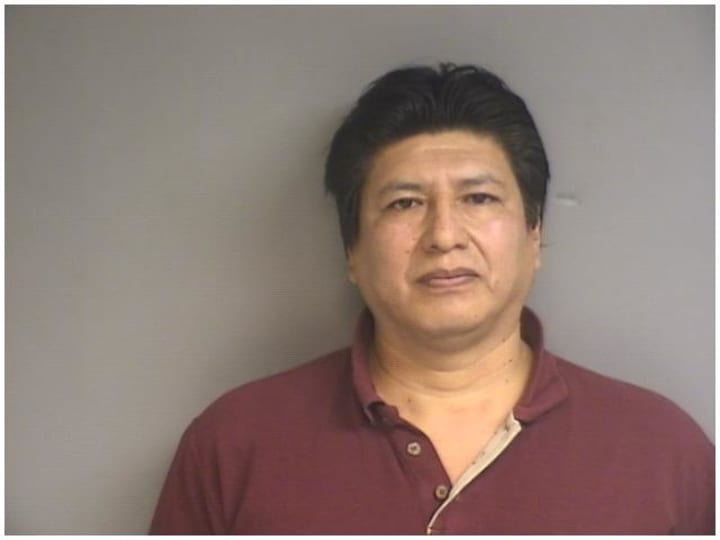 Carlos Abad, 50, of Stamford, has been charged with sexual assault, police say. 
